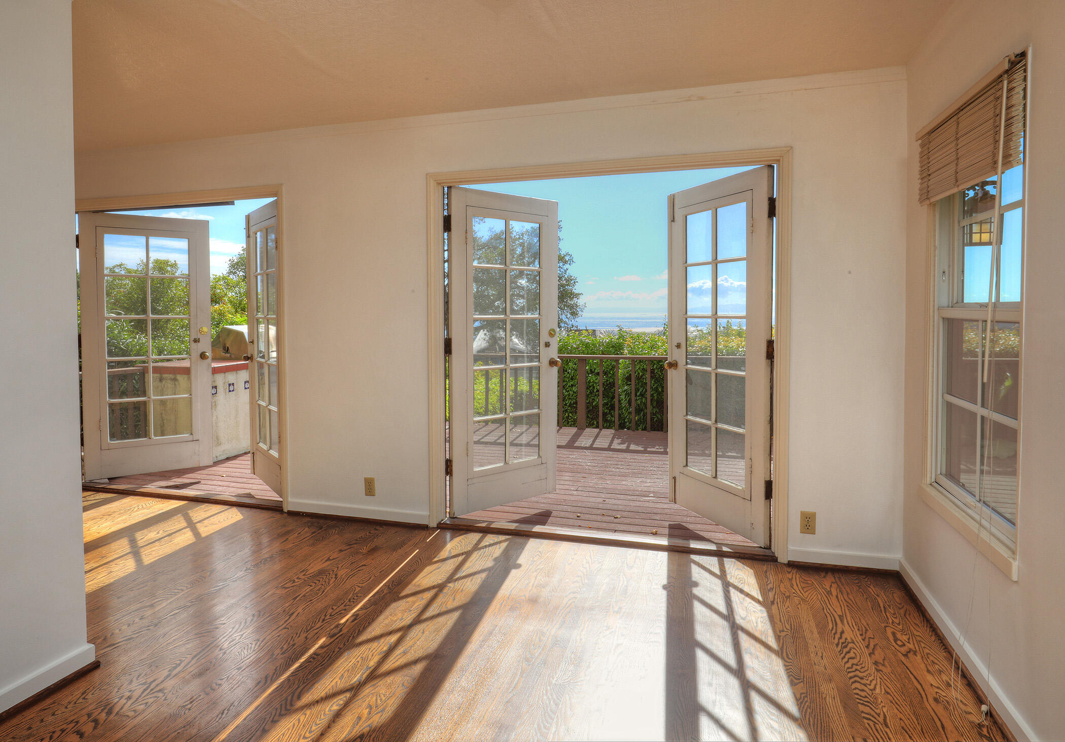 1712 Lasuen Road Santa Barbara, CA 93103 - Photo 8 of 38 a view of empty room with wooden floor and fan