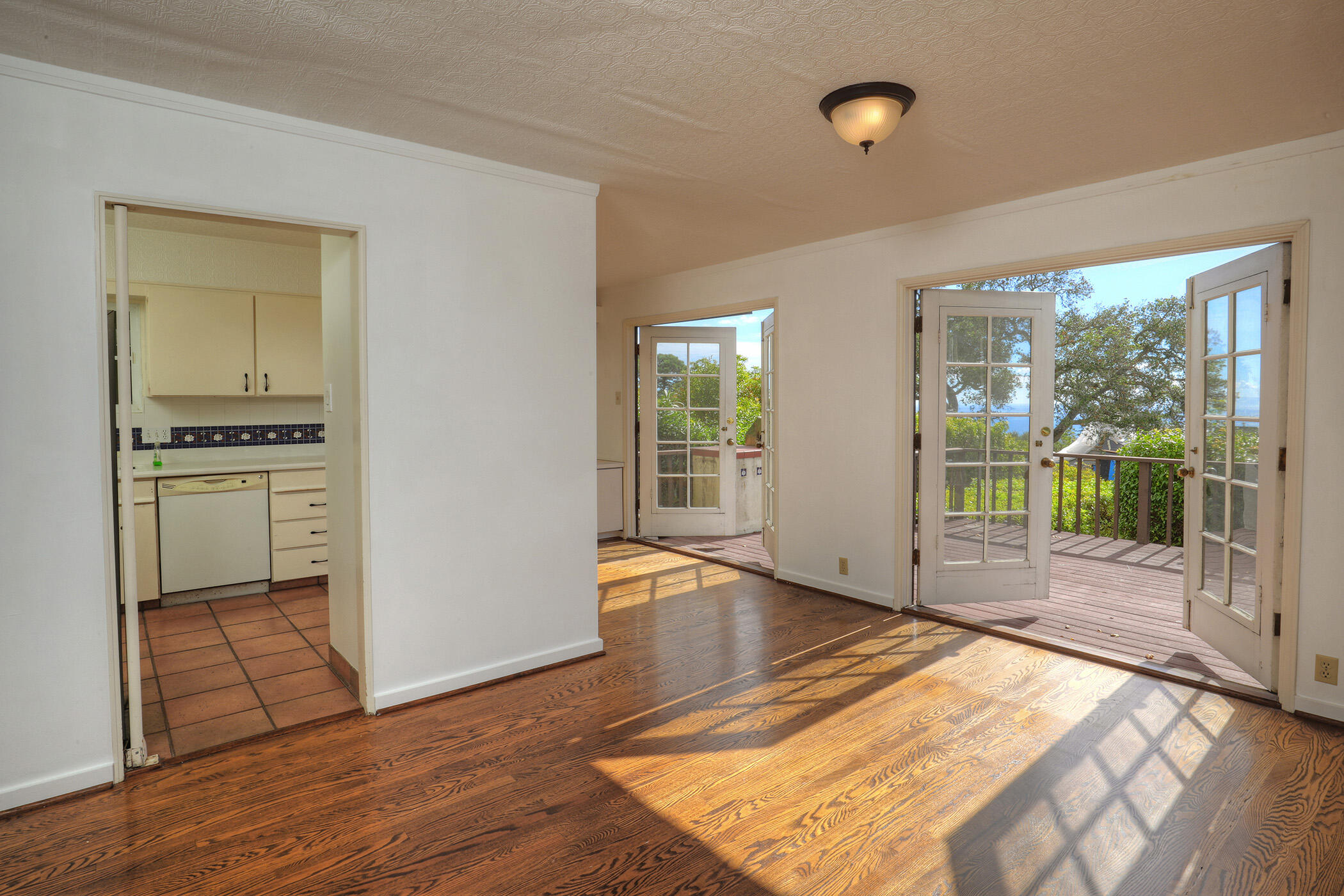 1712 Lasuen Road Santa Barbara, CA 93103 - Photo 9 of 38 a view of a room with wooden floor and windows