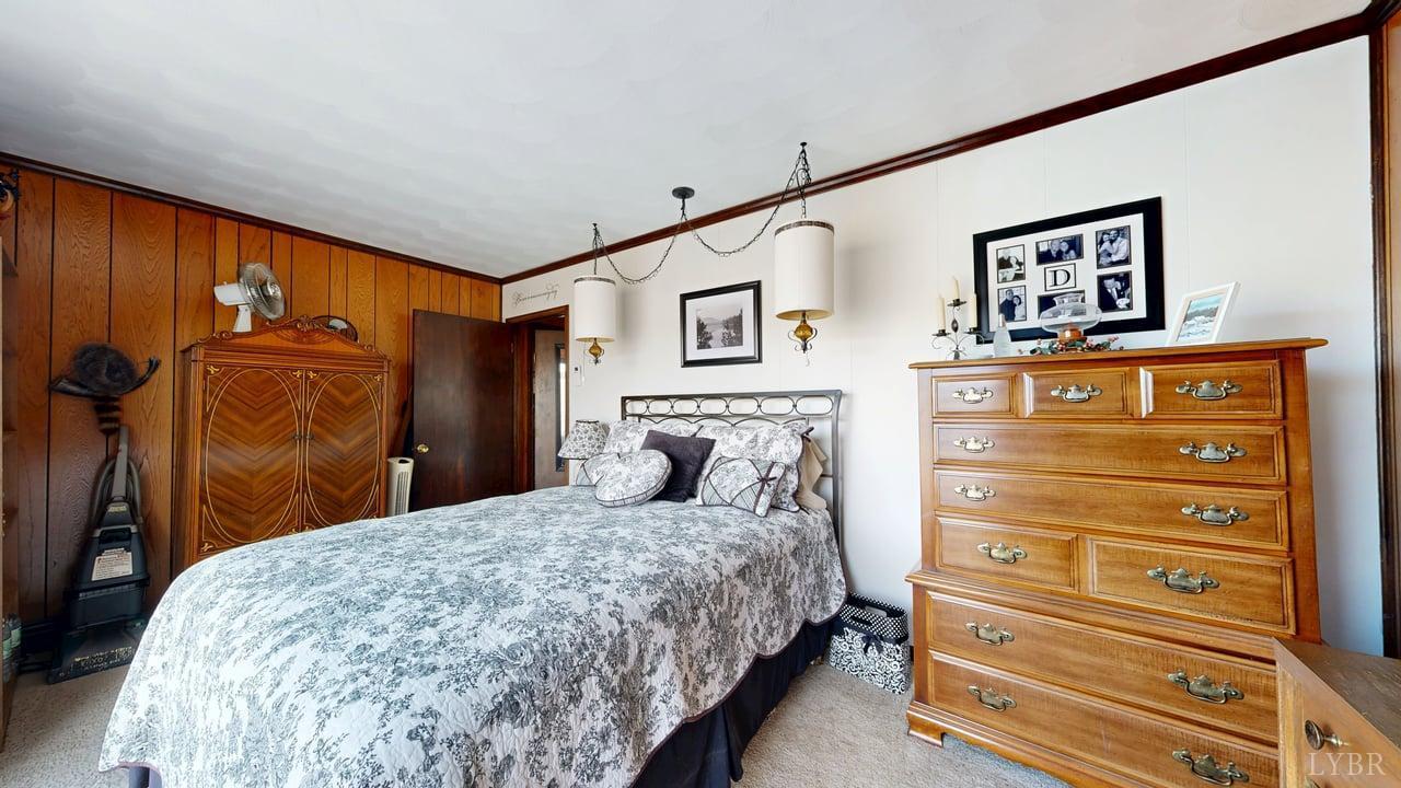 426 Burgess Road Madison Heights, VA 24572 - Photo 28 of 51 a bedroom with a bed and a dresser