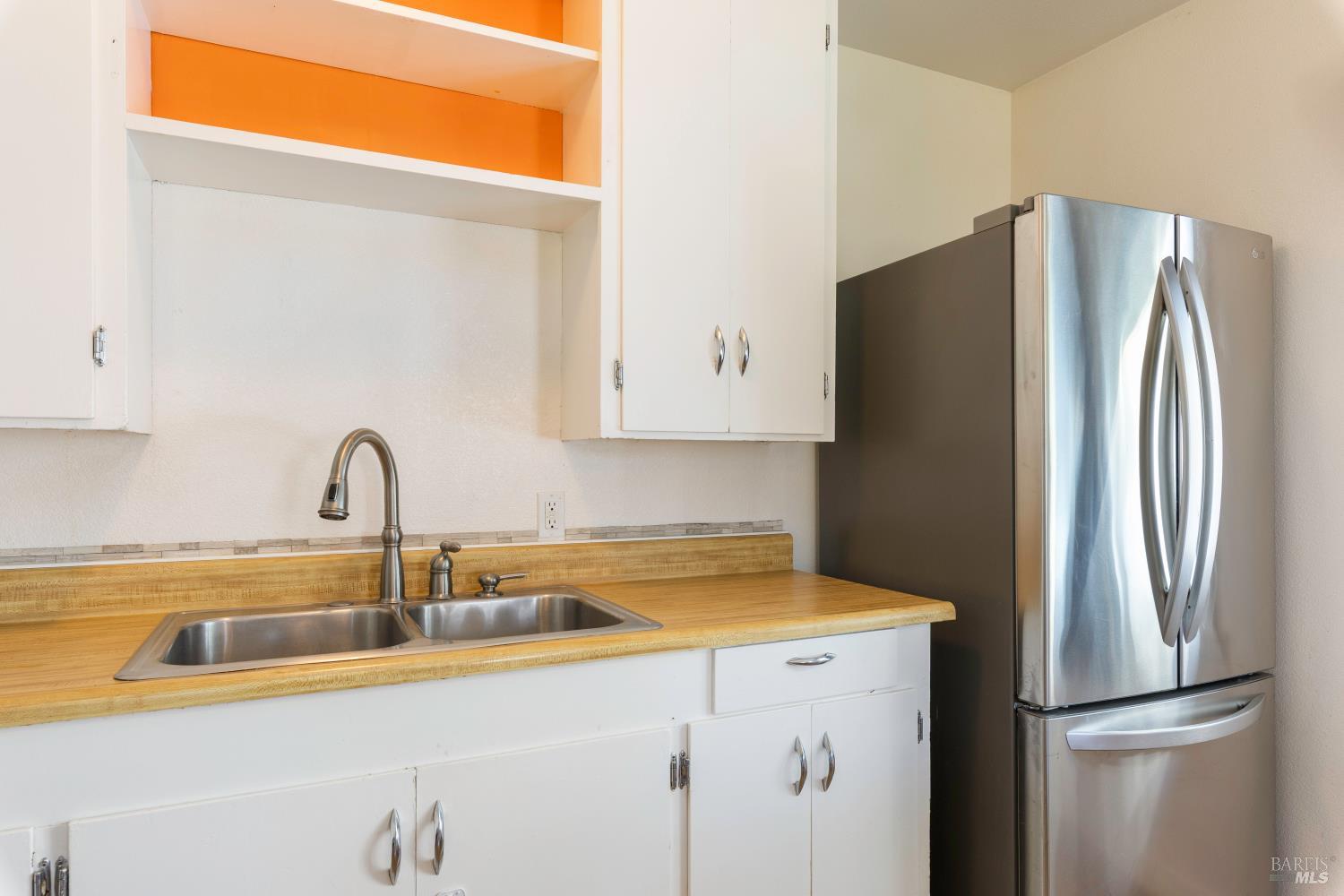 13780 Mountain House Road Hopland, CA 95449 - Photo 11 of 34 a kitchen with a refrigerator sink and cabinets