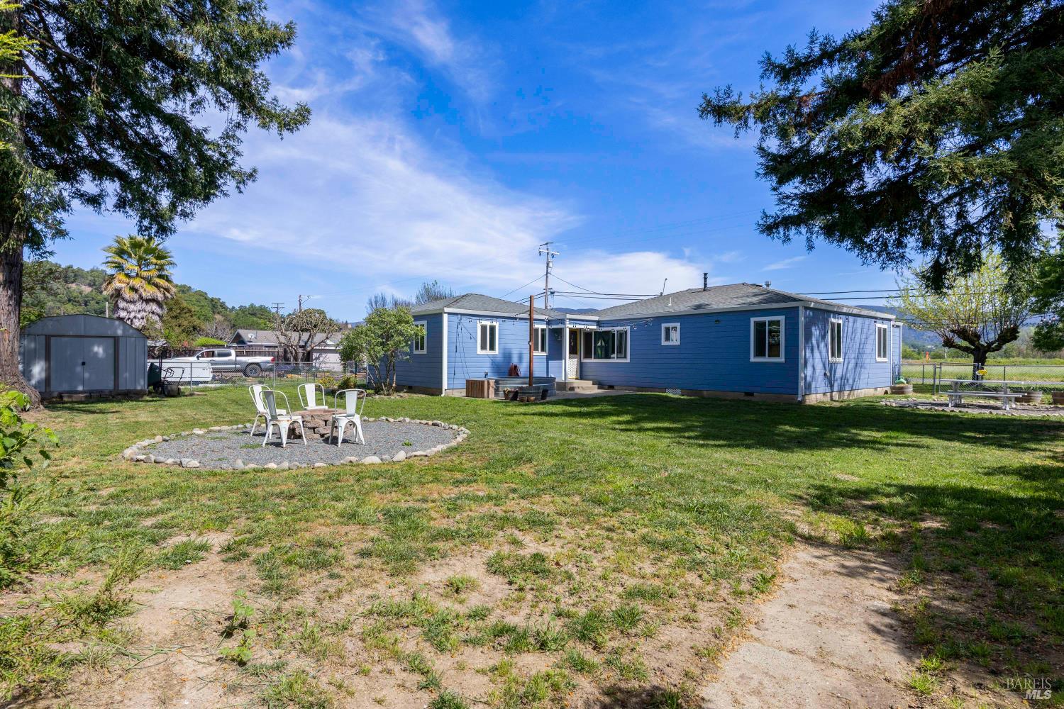 13780 Mountain House Road Hopland, CA 95449 - Photo 26 of 34 a view of a house with a yard porch and sitting area