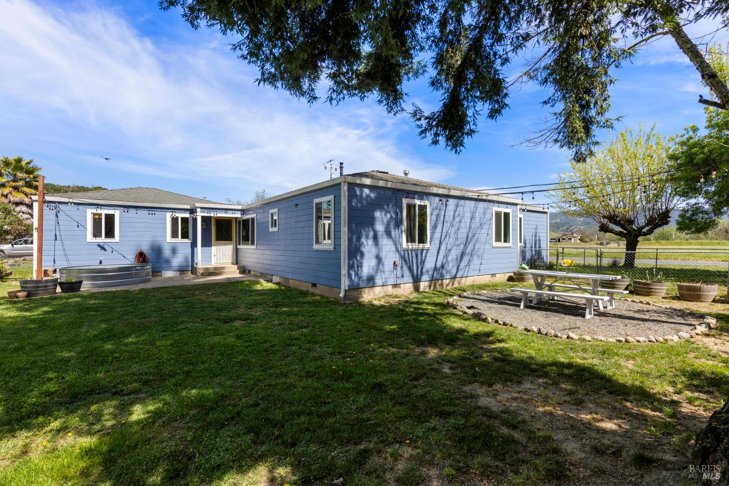 13780 Mountain House Road Hopland, CA 95449 - Photo 29 of 34 a view of a house with backyard and porch