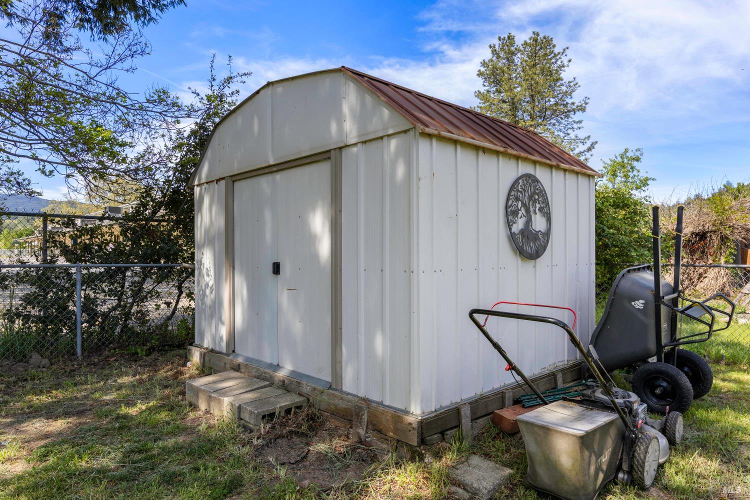 13780 Mountain House Road Hopland, CA 95449 - Photo 32 of 34 a backyard of a house with table and chairs