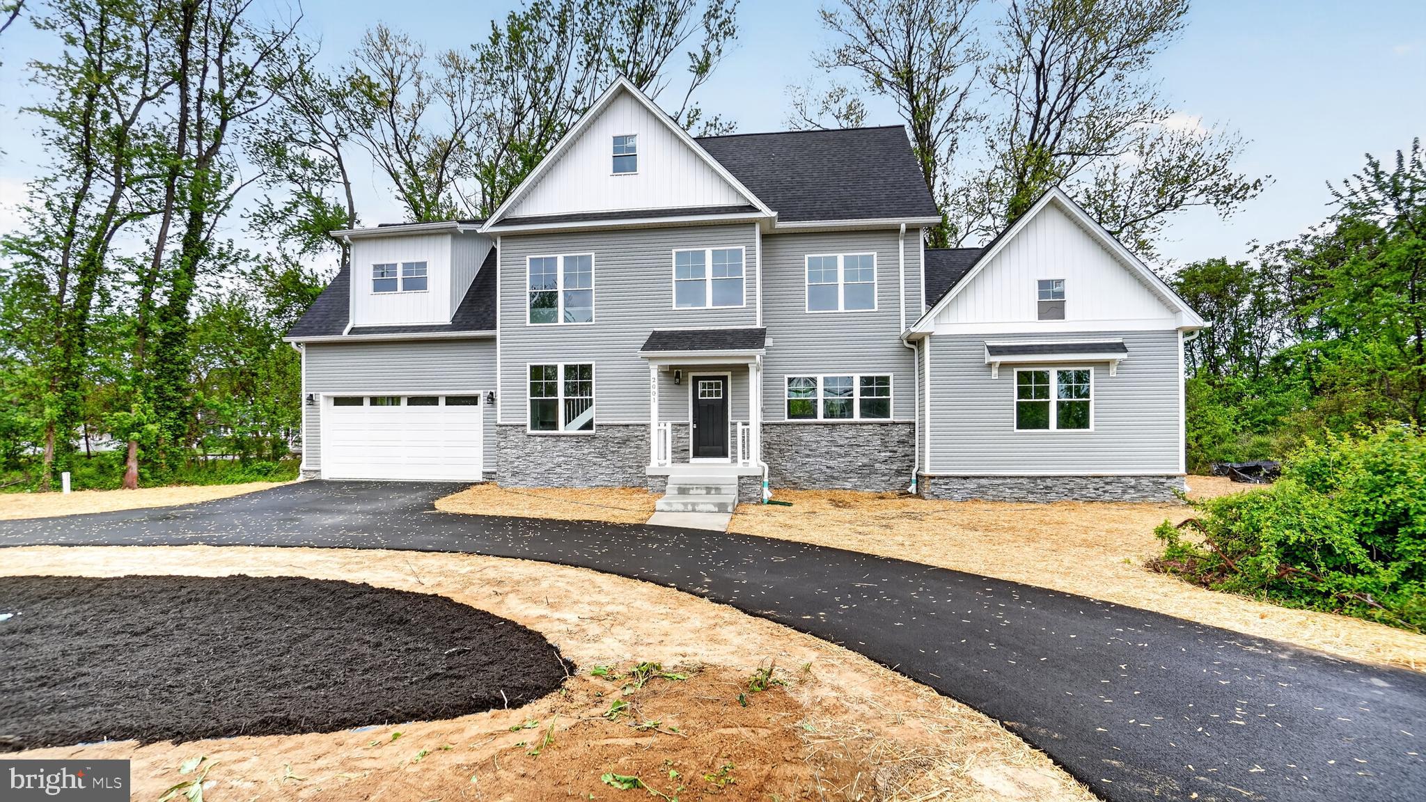 2001 Poplar Ridge Road Pasadena, MD 21122 - Photo 69 of 83 front view of a house with a yard
