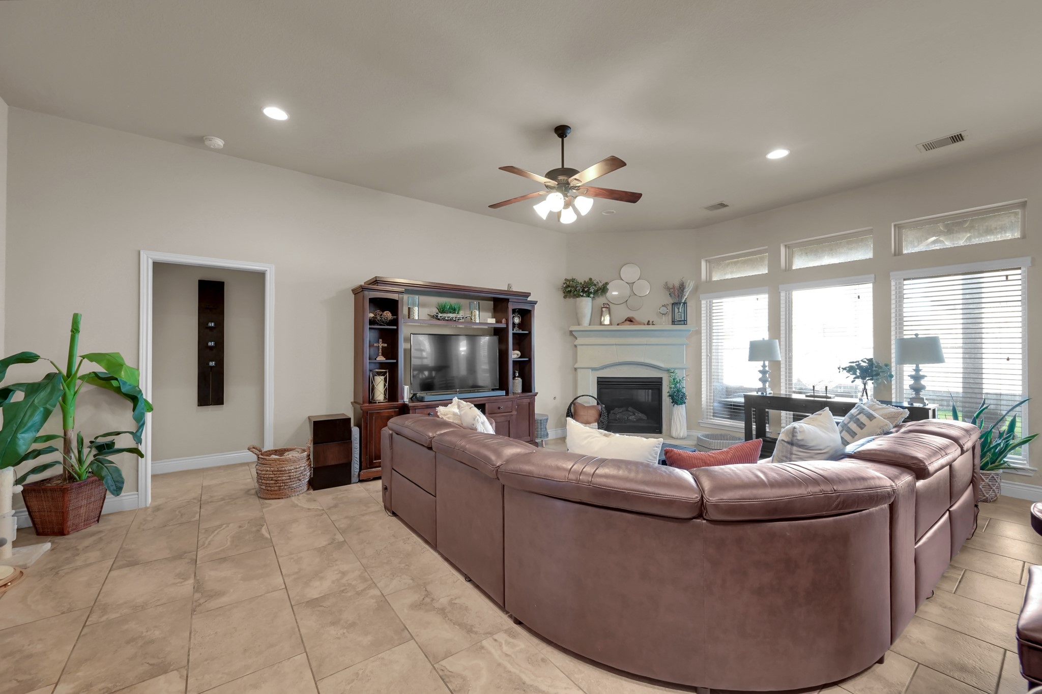 3814 Trophy Ridge Spring, TX 77386 - Photo 14 of 39 a living room with furniture a fireplace and a chandelier