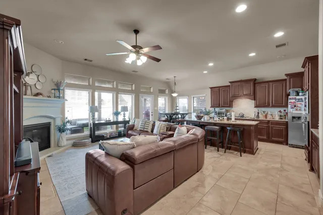 a dining room with granite countertop furniture a window and kitchen view
