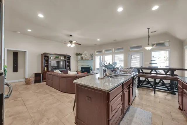a bedroom with a bed and a lamp on desk