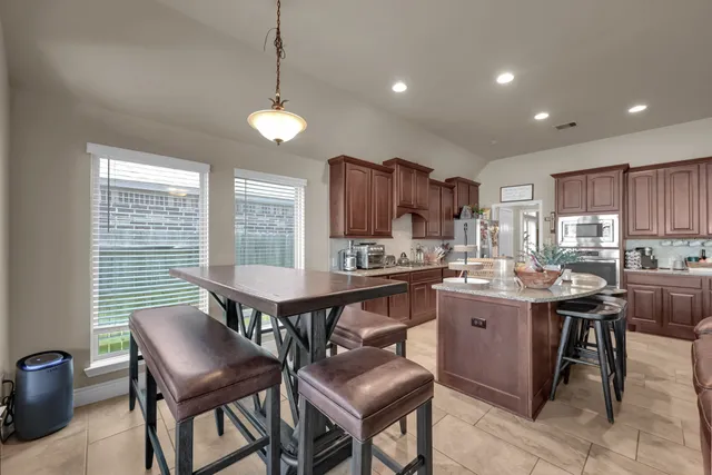 a bathroom with a double vanity sink toilet and a mirror