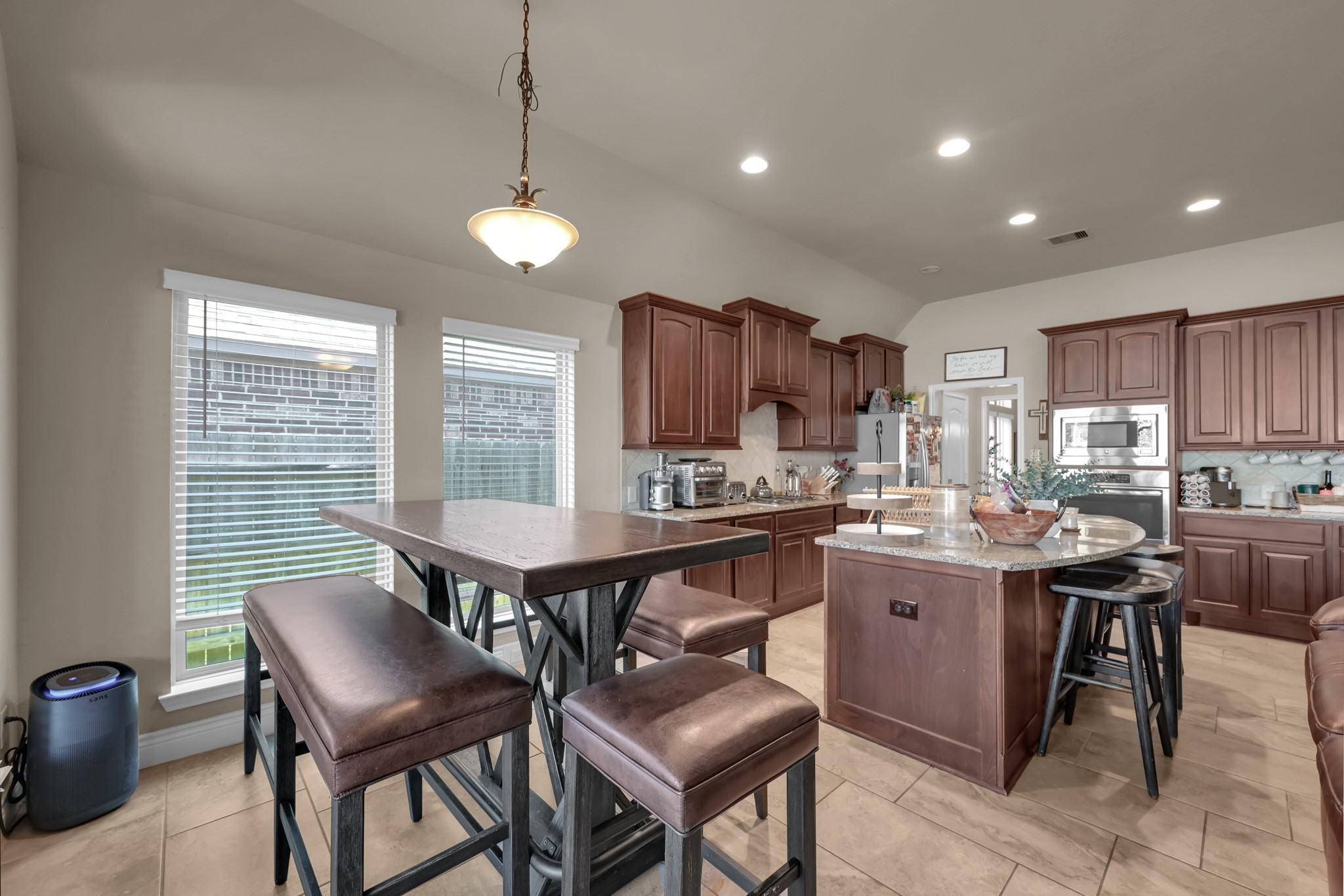 3814 Trophy Ridge Spring, TX 77386 - Photo 22 of 39 a dining room with granite countertop furniture a window and kitchen view