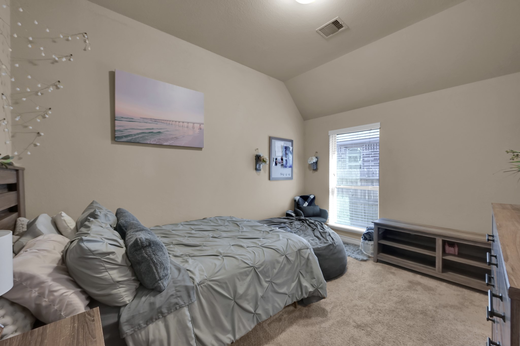 3814 Trophy Ridge Spring, TX 77386 - Photo 29 of 39 This cozy bedroom features neutral walls, a plush carpet, and a large window allowing natural light and creating a welcoming and comfortable atmosphere.