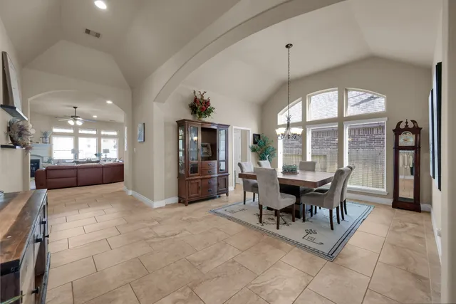 a dining room with furniture and window
