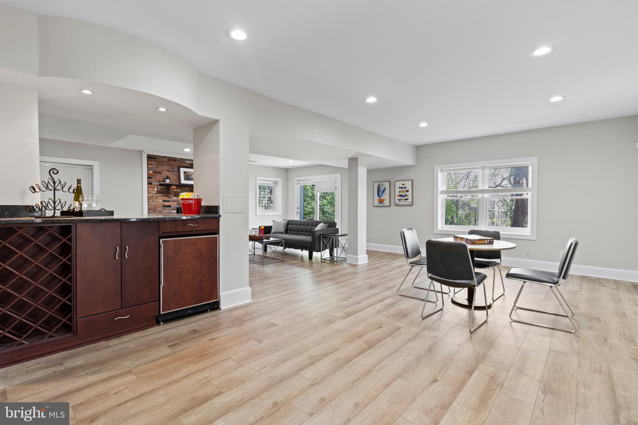 13601 Query Mill Road North Potomac, MD 20878 - Photo 43 of 69 Lower Level Rec Room w/ Wet Bar and Fireplace