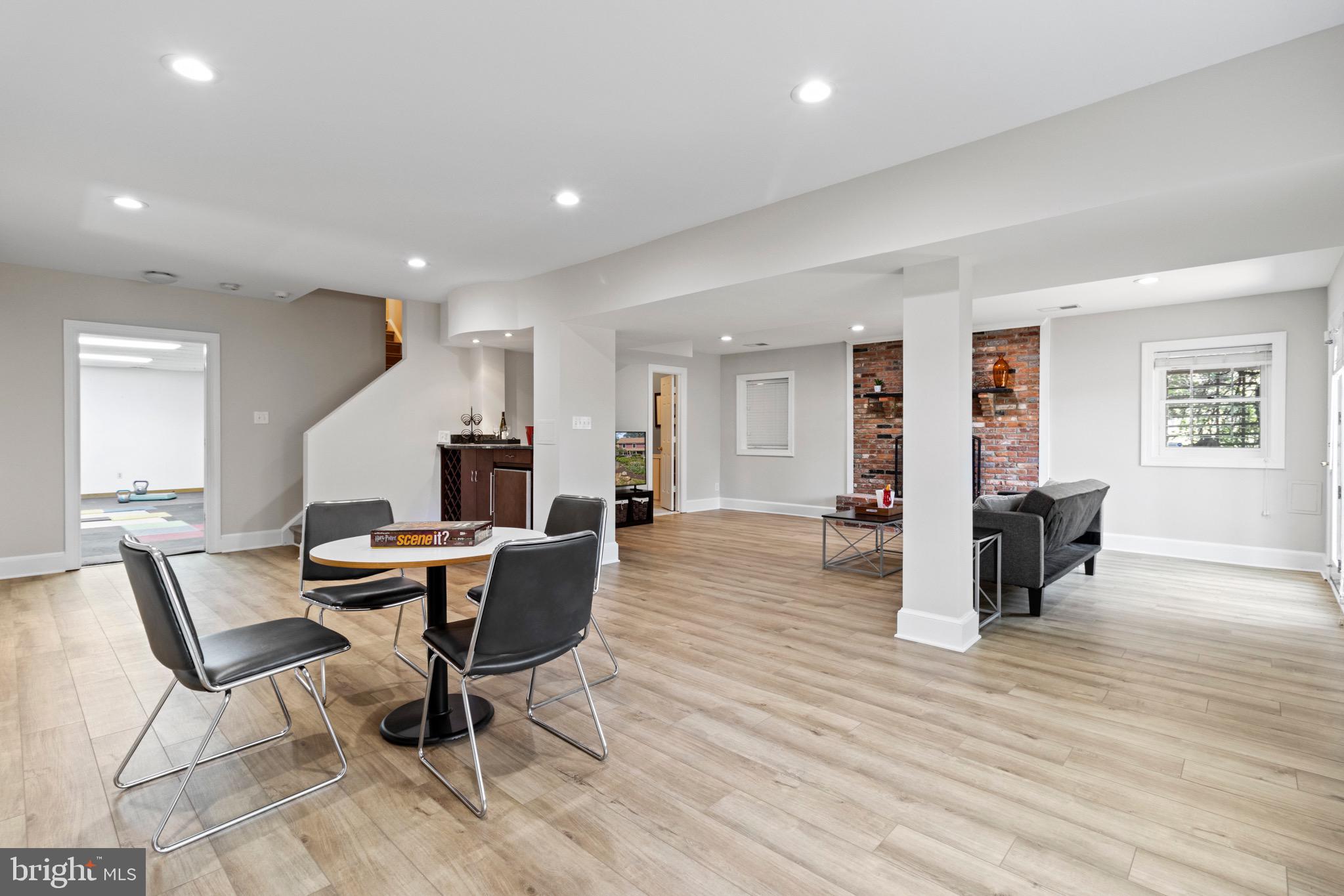 13601 Query Mill Road North Potomac, MD 20878 - Photo 44 of 69 Lower Level Rec Room w/ Wet Bar and Fireplace