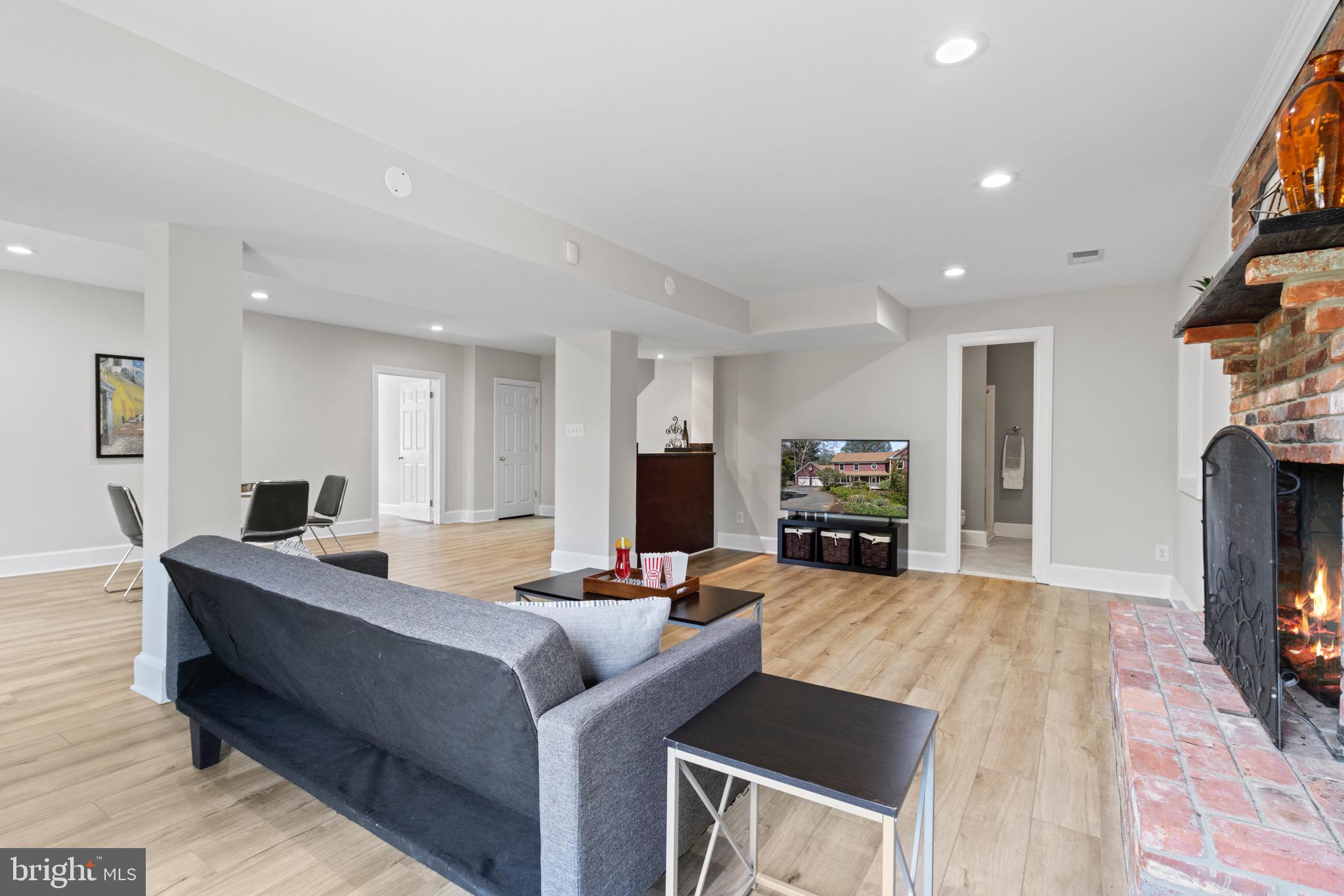 13601 Query Mill Road North Potomac, MD 20878 - Photo 45 of 69 Lower Level Rec Room w/ Wet Bar and Fireplace