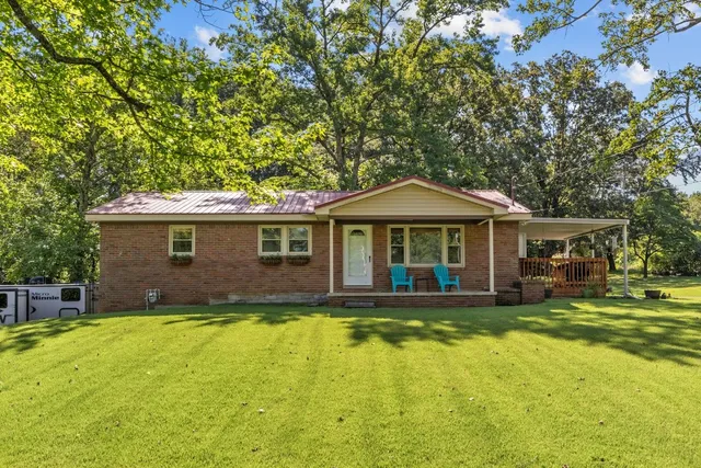 a front view of a house with swimming pool
