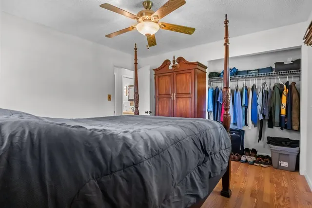 a bed room with a bed and a walk in closet