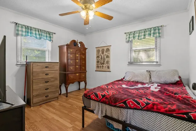 a bedroom with a bed and a dresser