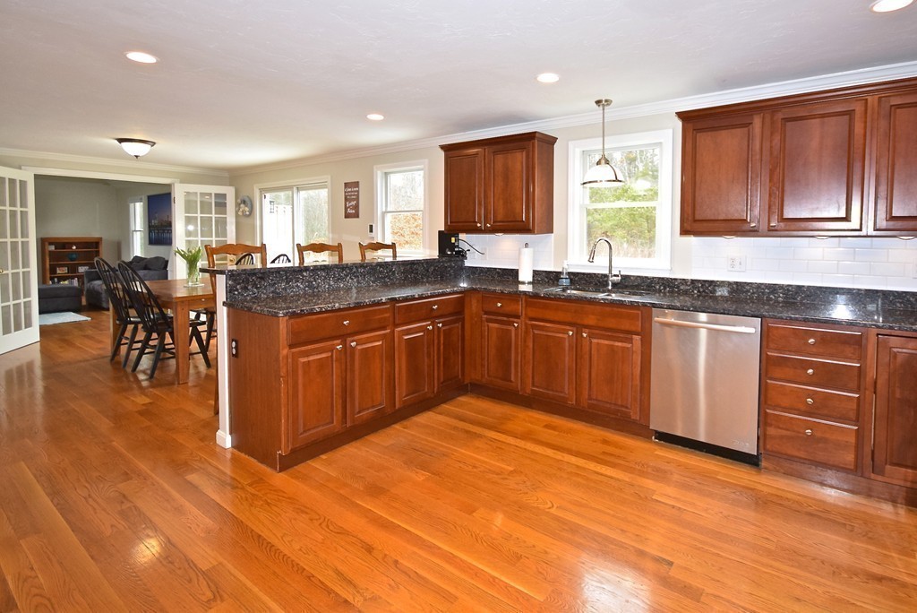 16 Cromwell Lane Rochester, MA 02770 - Photo 3 of 25 a kitchen with stainless steel appliances granite countertop a sink and cabinets
