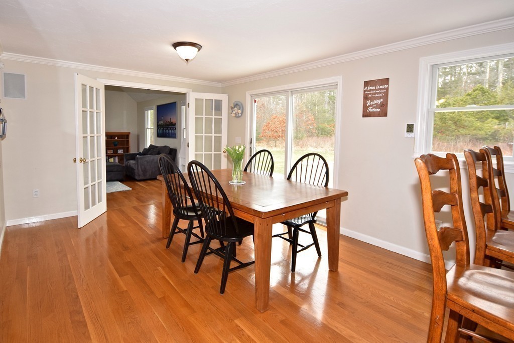 16 Cromwell Lane Rochester, MA 02770 - Photo 7 of 25 a dining room with furniture window wooden floor