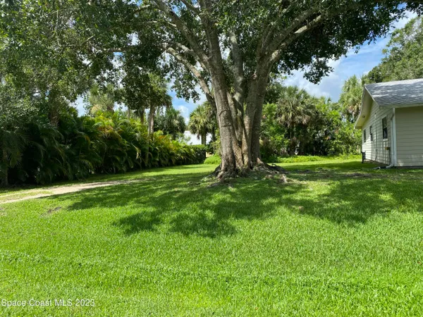 a kitchen with a sink cabinets and a window