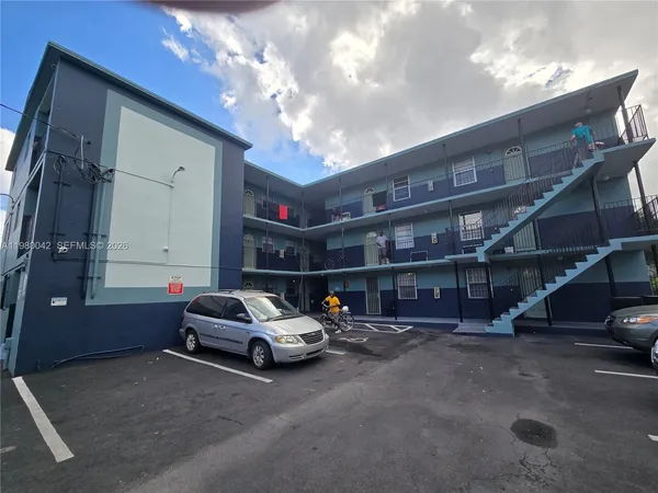 a car parked in parking lot of building
