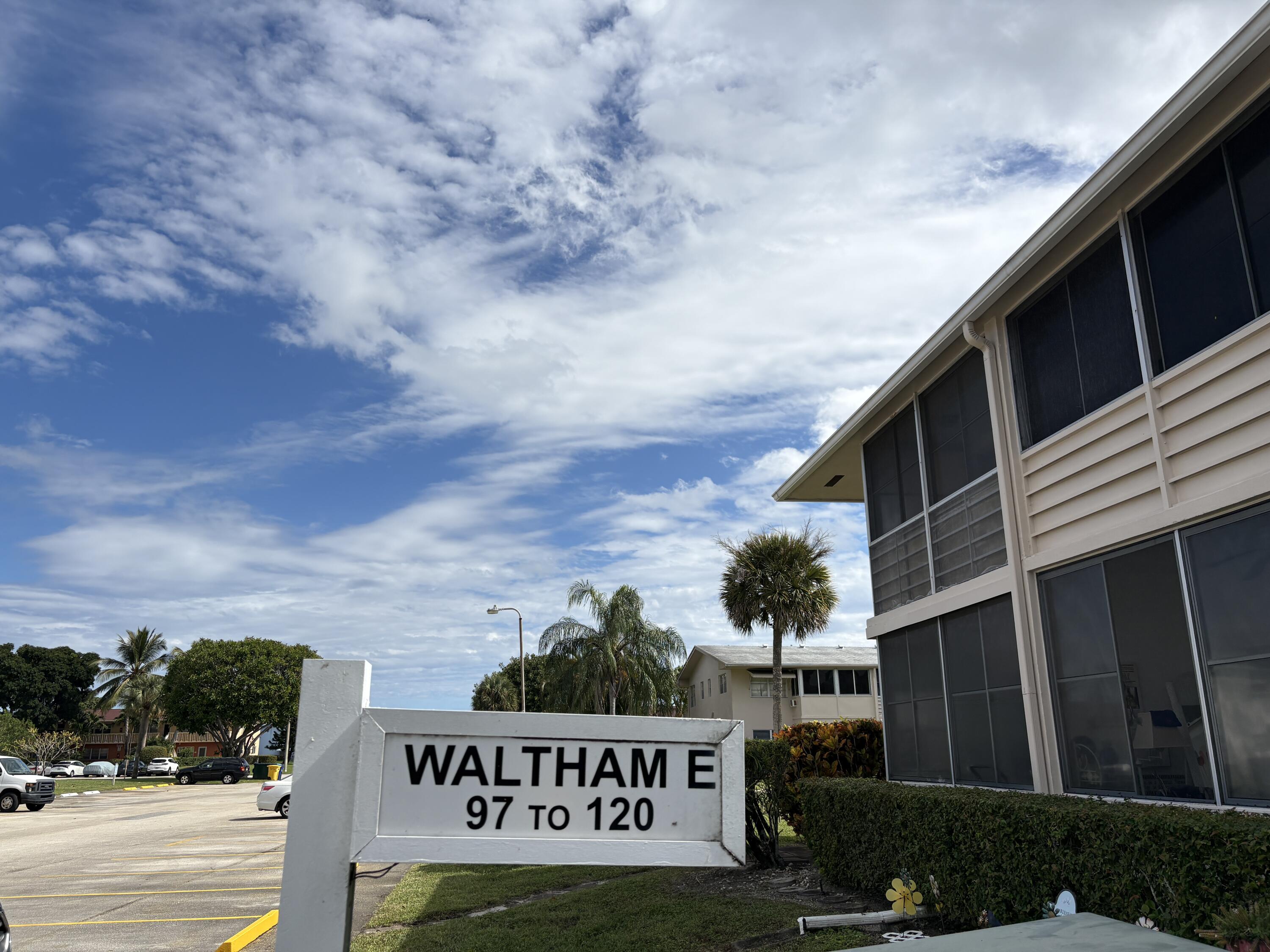 113 Waltham East West Palm Beach, FL 33417 - Photo 9 of 24 a view of sign board with buildings in the background