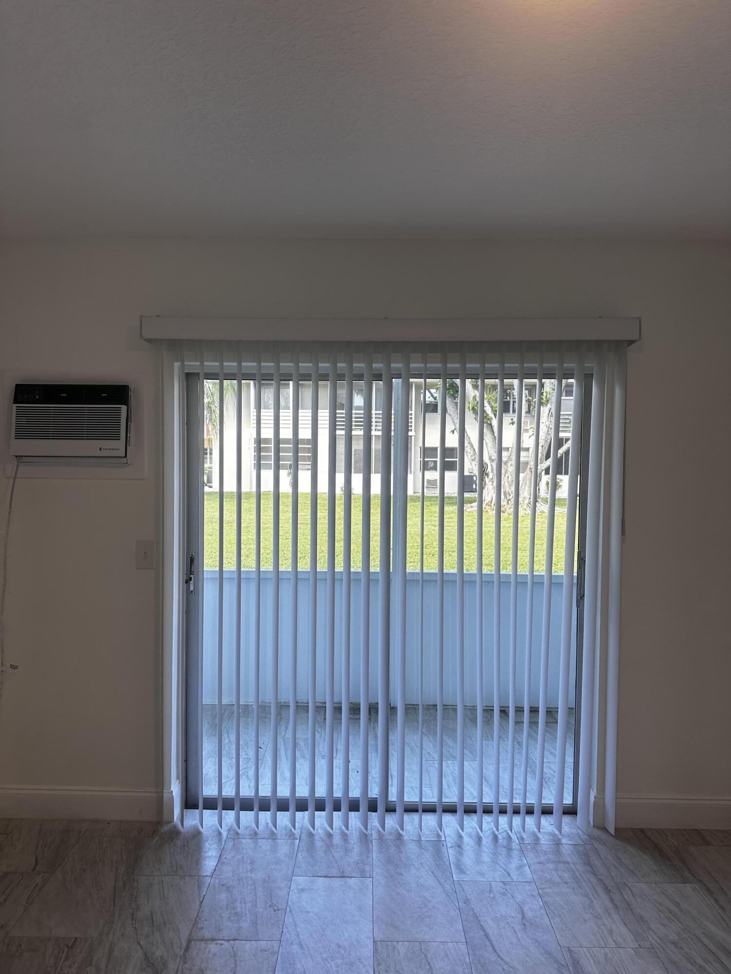 113 Waltham East West Palm Beach, FL 33417 - Photo 10 of 24 a view of an empty room with wooden floor