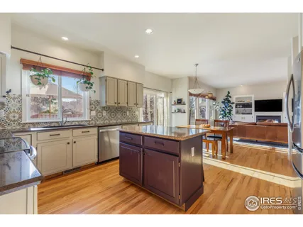 a kitchen with stainless steel appliances granite countertop a sink and cabinets