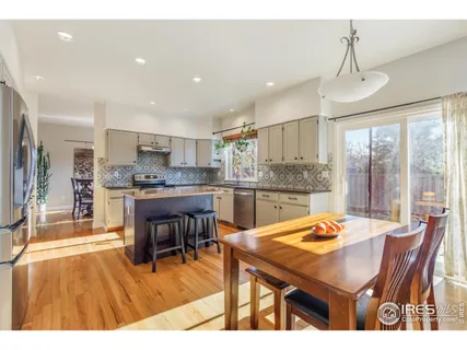 a open kitchen with a table and chairs