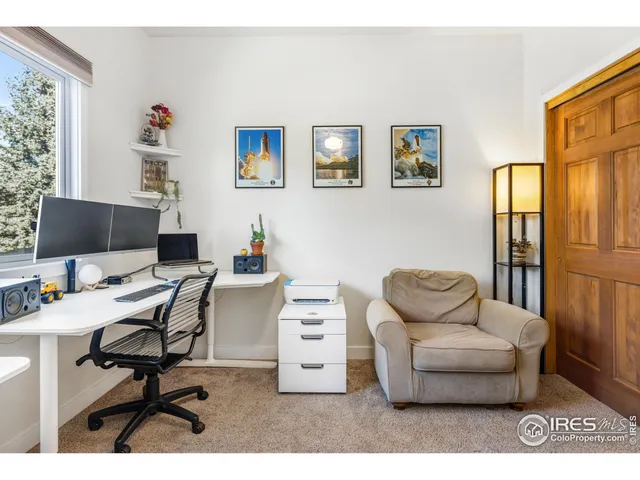 a workspace with furniture and a window