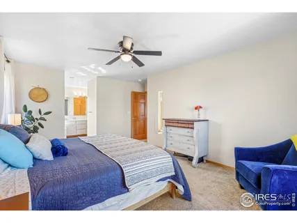 a bedroom with a bed and dresser