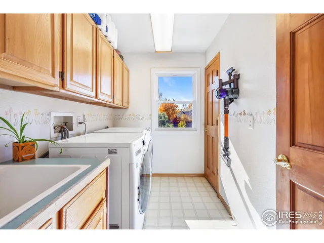 a utility room with a sink a washer and dryer