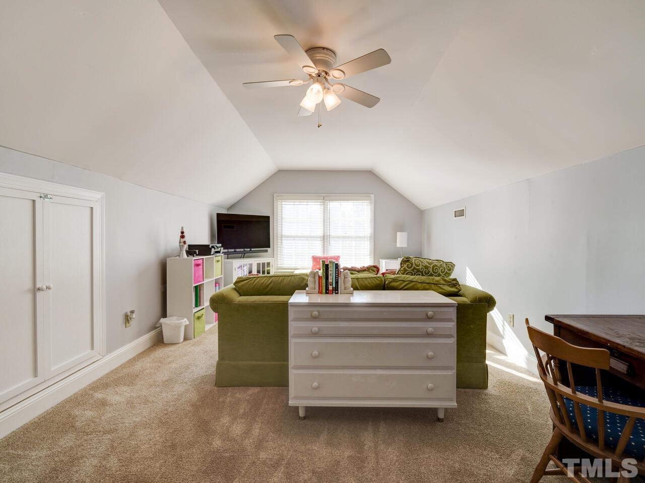 11816 Radner Way Raleigh, NC 27613 - Photo 20 of 54 a living room with furniture and a flat screen tv