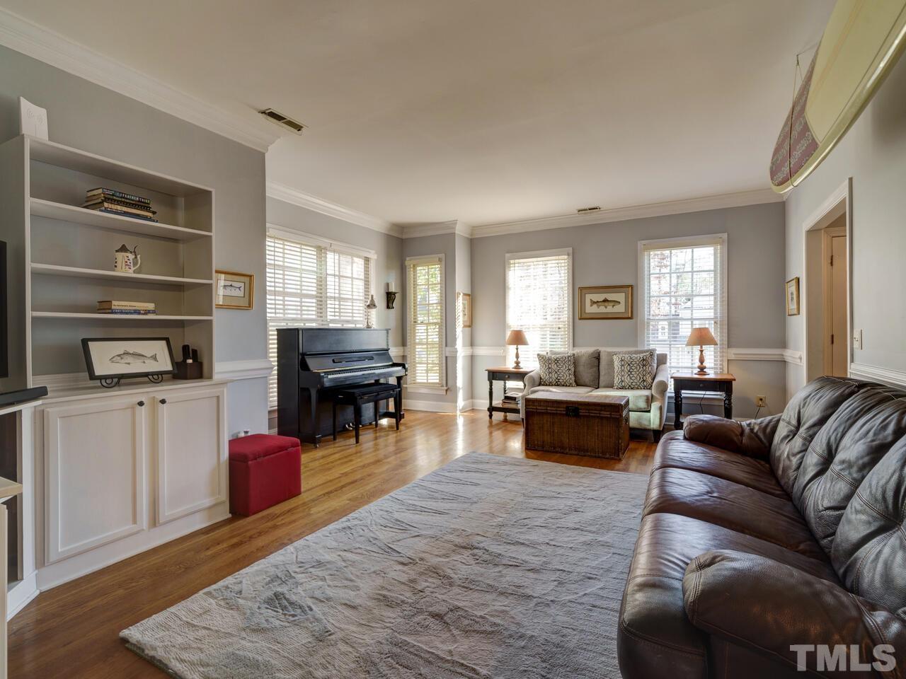 11816 Radner Way Raleigh, NC 27613 - Photo 6 of 54 a living room with furniture and a fireplace