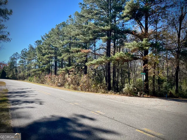 a view of a house with a tree