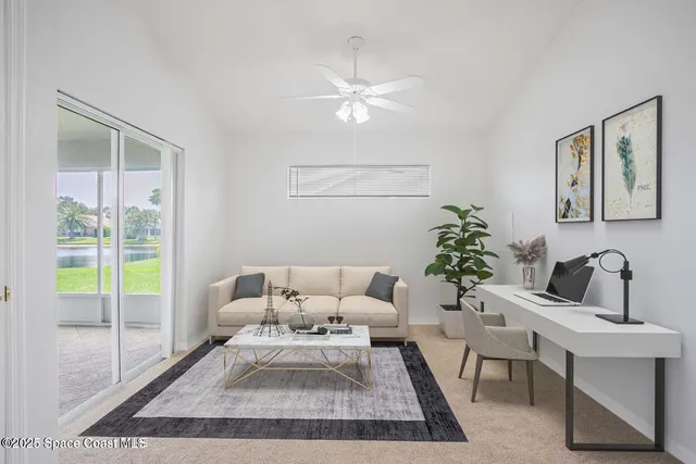 a living room with furniture and a potted plant