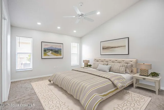 a bedroom with a large bed and a couch