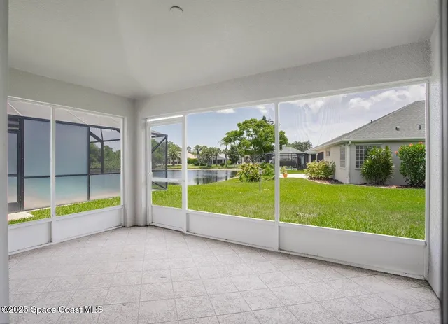a view of an empty room with a balcony