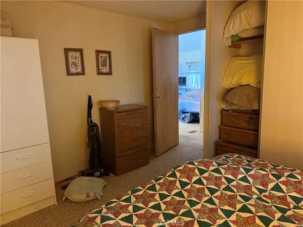 a bedroom with a bed and a cabinets