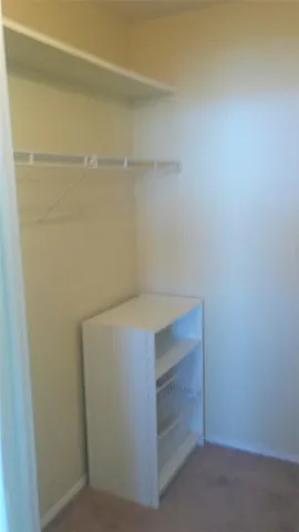 a bathroom with a shower a toilet and sink