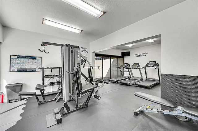 a view of a patio with a table and chairs in patio