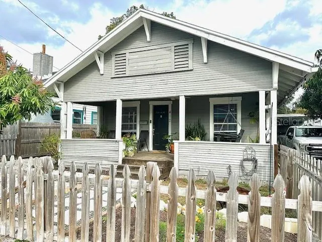 a front view of a house with a small yard