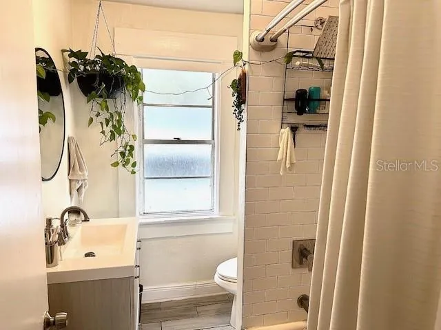 a bathroom with a tub and shower