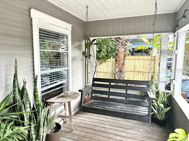 a view of a balcony with chairs