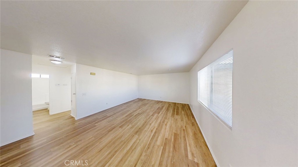13475 4th Street, Unit 5 Yucaipa, CA 92399 - Photo 3 of 10 a view of empty room with wooden floor