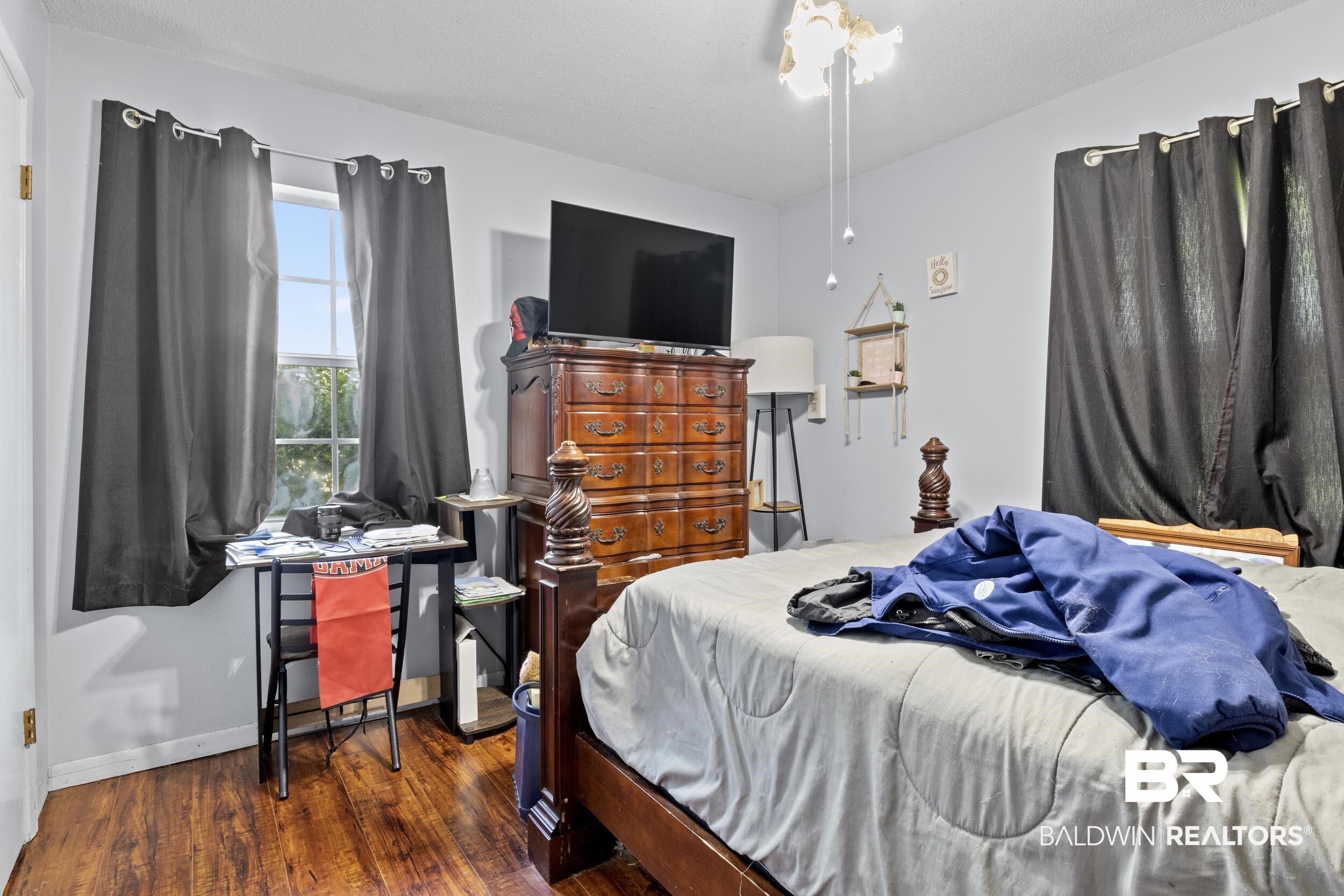 8701 A Rosemary Road Eight Mile, AL 36613 - Photo 16 of 27 Bedroom featuring dark hardwood / wood-style flooring