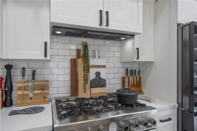 a kitchen with a stove and cabinets
