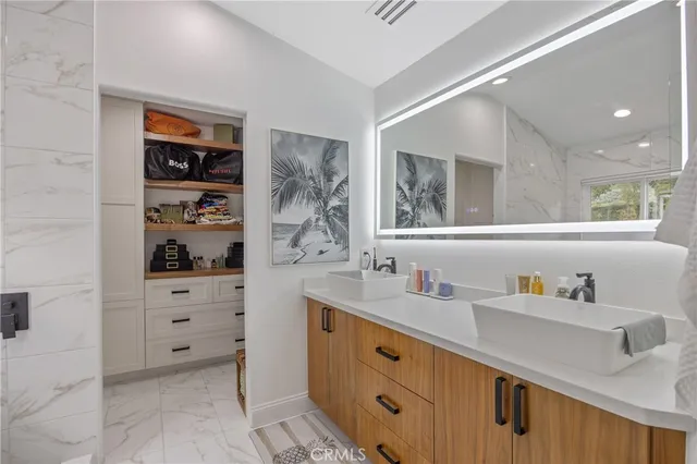 a kitchen with a refrigerator and cabinets