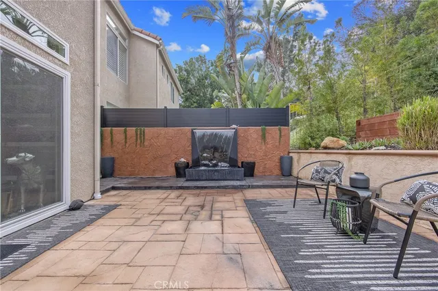 a view of a balcony with chair and table