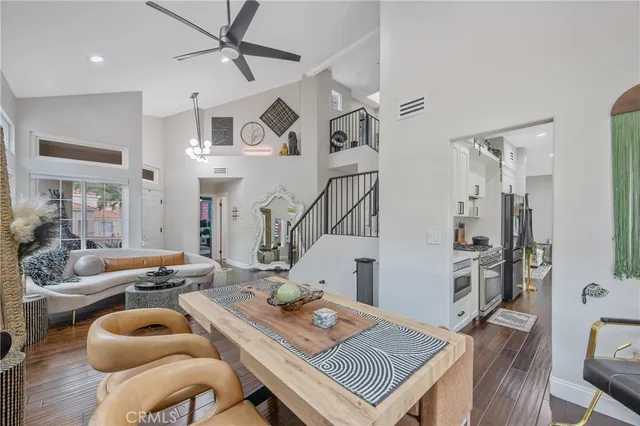 a living room with furniture and kitchen view